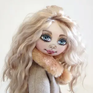 Doll head  showing natural fibers hair.