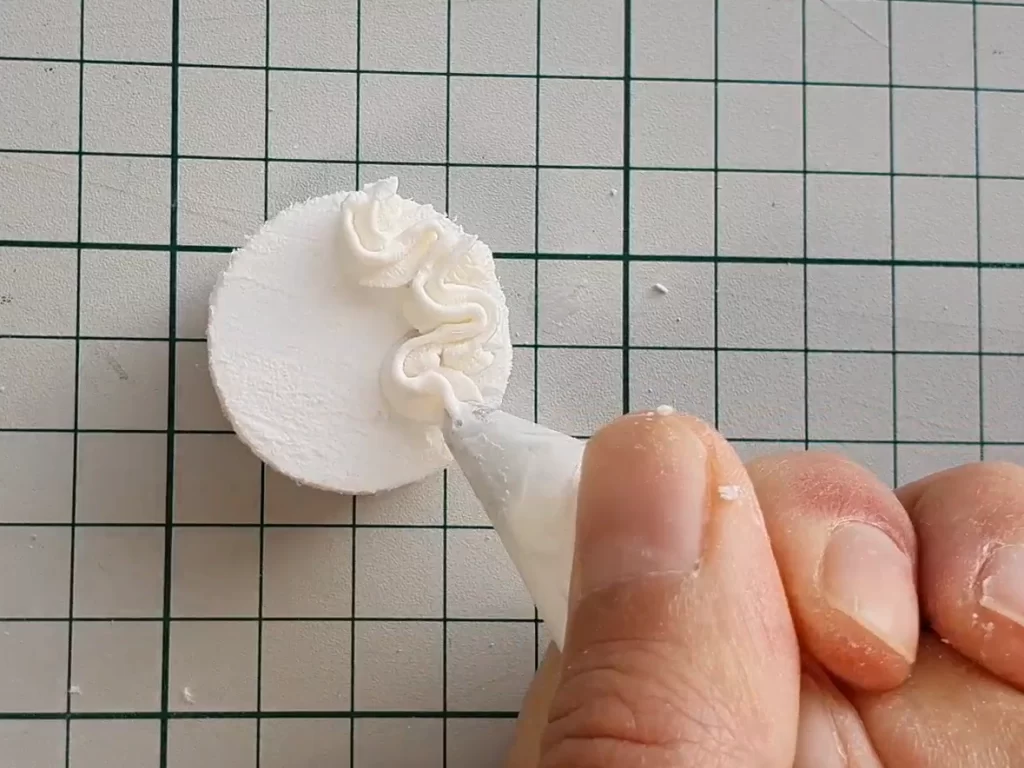 Miniature doll cake frosting